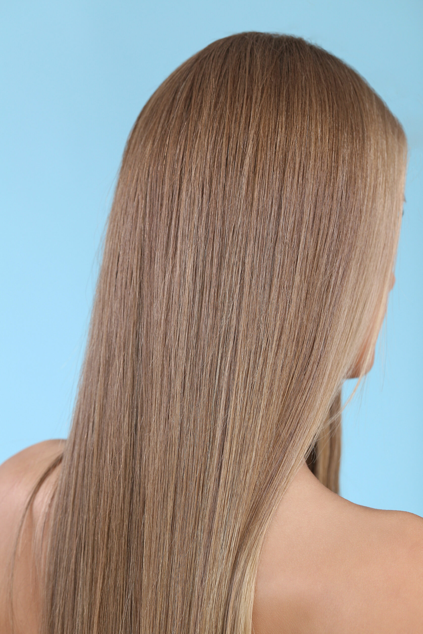 Woman with beautiful hair on a blue background